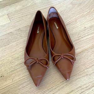 Beautiful Larroude flats. Slight wear at the tip of one that can be polished out